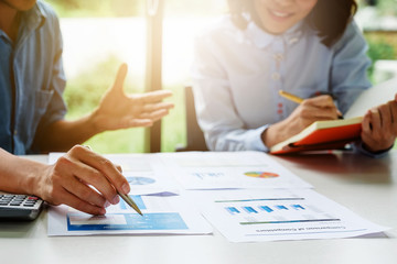 Businessman and partner hand holding pencil and making presentation business strategy.