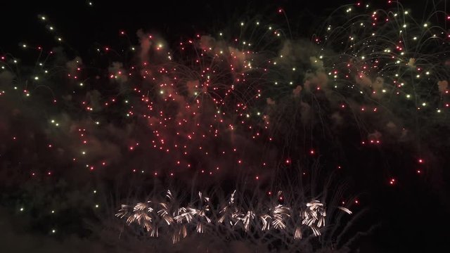 Beautiful colorful fireworks display for celebration on black background, New year holiday concept stock footage video