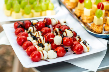 buffet Assortment of canapes. Banquet service. catering food, snacks with mixed fingerfood appetizers