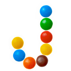 Letter J of sweet colored candies, alphabet isolated on white