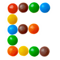 Letter E of sweet colored candies, alphabet isolated on white