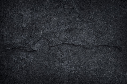 Dark grey black slate stone background or texture
