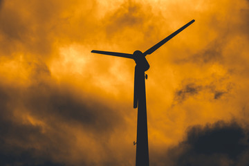 Silhouette wind turbine with dusk sky for power shortage crisis concept © Quality Stock Arts