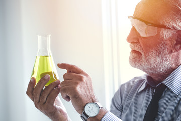 Master professional of chemistry scientist to looking at new chemical formula in lab