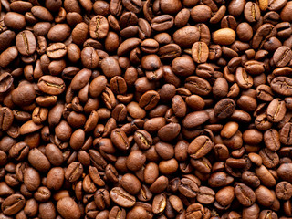 Close-up roasted coffee beans background, top view, copy space