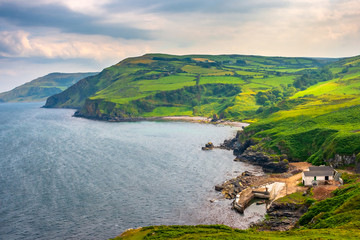 Scenic landscape of green coastline at Torr Head, Antrim, Northern Ireland. Causeway coastal route © Monica