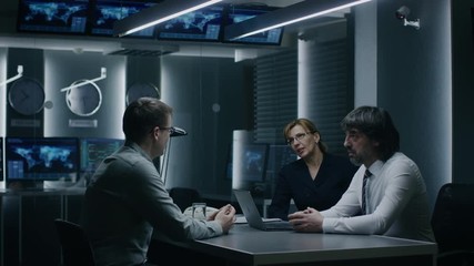 On a Job Interview Two Senior Managers Ask Young Candidate Questions. Secret Service Recruiting Talented Young Man. Serious People Working in Government Agency. - Powered by Adobe