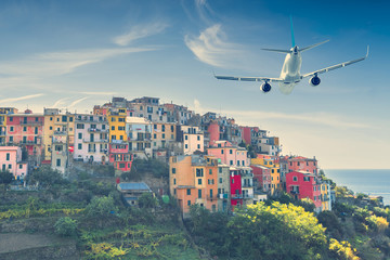 Airplane flying over an old European city