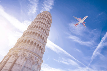 Airplane flying over Leaning Tower of Pisa in Italy