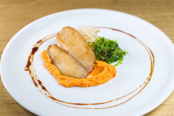 fried fish fillet with pumpkin paste and algae chuka