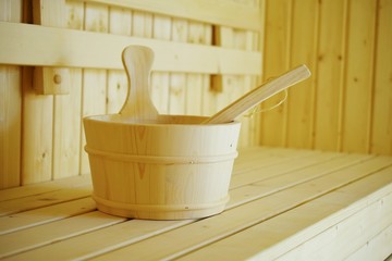 Obraz na płótnie Canvas wooden sauna bucket accessories interior of sauna spa