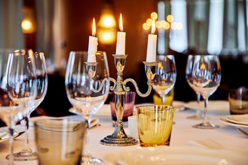 table setting with candelabrum - obrazy, fototapety, plakaty