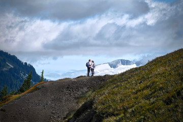 Young married couple hiking in mountains. Elfin Lakes trail in Garibaldi Provincial Park near Whistler. British Columbia. Canada.
