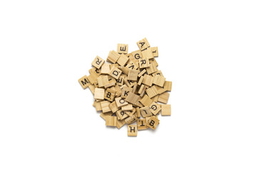 Wooden tablets with alphabet letters for table games. White isol