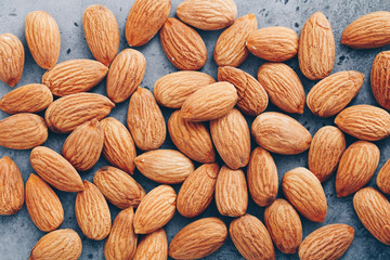 Fresh almond nuts. Top view. Food background.