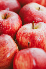 Harvest of ripe apples variety Red Delicious. Food background, top view, flat lay.
