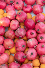 Ripe, freshly picked pomegranates and oranges