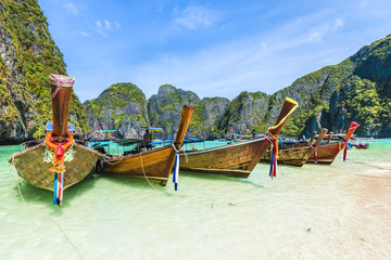 Fototapeta na wymiar Traditional long tail boat on famous Maya Bay, Phi Phi Islands, Thailand