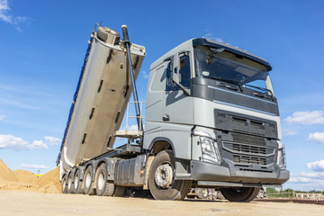 Delivery of sand to the construction site by truck