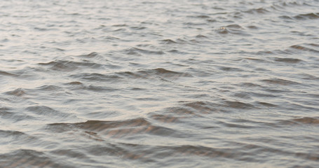 waves at sunset with caustics