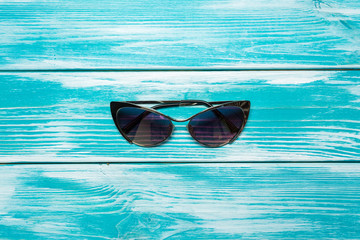 sun glasses on wooden table