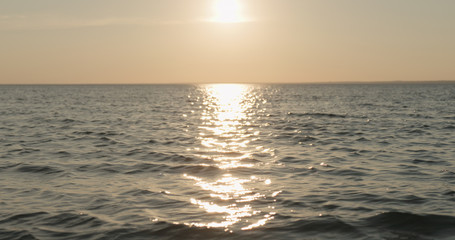 waves on a beach on a windy sunny evening