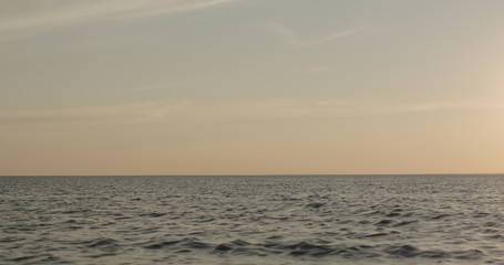 waves on a beach on a windy sunny evening