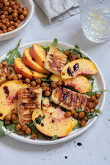 Green salad with grilled halloumi cheese and peaches