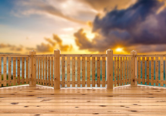 3D render. View from spruce wood terrace, porch or balcony on sea at sunset.