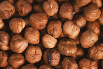 Roasted hazelnuts background top view