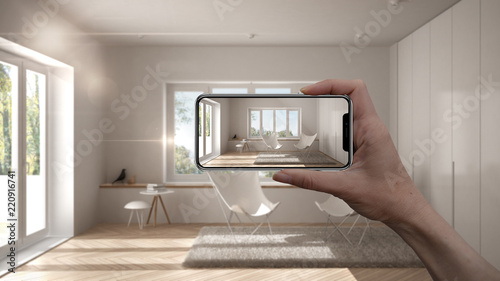 Hand holding smart phone, AR application, simulate furniture and ... Hand holding smart phone, AR application, simulate furniture and ...