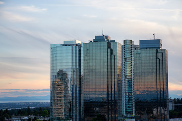 Aerial view of commercial and residential buildings during a vibrant summer sunset. Located near Metrotown Mall, Burnaby, Vancouver, BC, Canada. © edb3_16