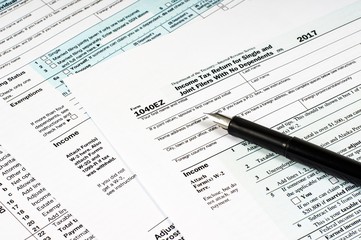 Tax Form 1040EZ and pen close-up