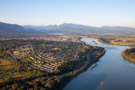 Aerial view of residential neighborhood in Port Coquitlam during a sunny summer sunset. Taken in Vancouver, BC, Canada.