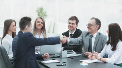 business partners shaking hands after a successful transaction