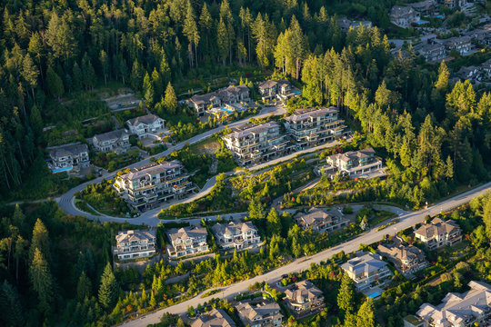 Aerial view of the big luxury homes on the hill during a vibrant sunny summer day. Taken in West Vancouver, British Columbia, Canada.