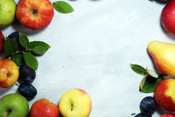Various fresh fruits. Thanksgiving apples, and pears on rustic background.