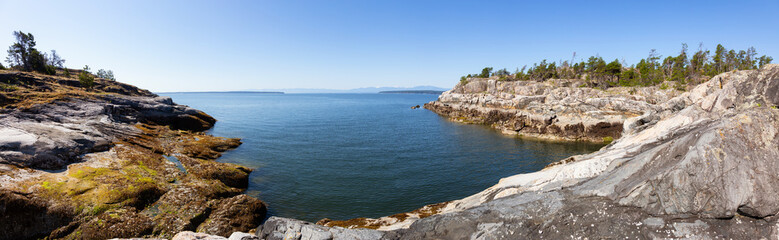 Panoramic Landscape view of the rocky Island during a vibrant sunny summer day. Taken near Powell River, Sunshine Coast, BC, Canada.
