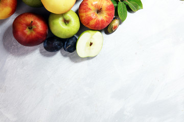 Various fresh fruits. Thanksgiving apples, and pears on rustic background.