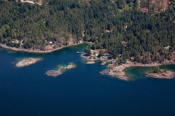 Aerial view of Rocky Islands near Madeira Park during a sunny summer day. Taken in Sunshine Coast, BC, Canada.