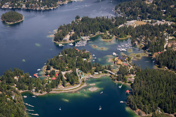 Fototapeta premium Aerial view of Madeira Park during a sunny summer day. Taken in Sunshine Coast, BC, Canada.