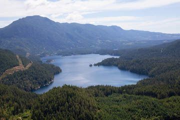Fototapeta na wymiar Aerial view of Ruby Lake during a sunny summer day. Taken in Sunshine Coast, BC, Canada.