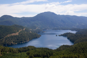 Fototapeta na wymiar Aerial view of Ruby Lake during a sunny summer day. Taken in Sunshine Coast, BC, Canada.