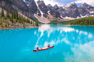 Canoeing on Moraine Lake, Banff National Park, Alberta, Canada - obrazy, fototapety, plakaty