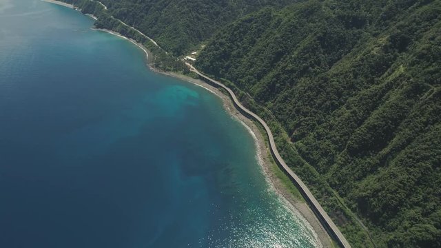 Aerial view of Patapat viaduct in the coast of Pagudpud, Ilocos Norte. Highway with bridge by coast sea near the mountains. Philippines, Luzon. Highway along the coast.