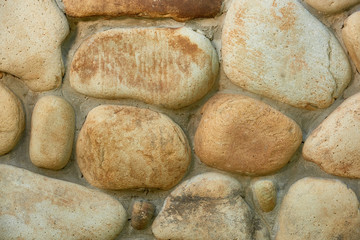 Fototapeta na wymiar close-up view of weathered stone wall texture, full frame background