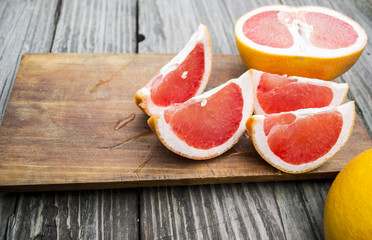 chopped citrus lobules against a tree background