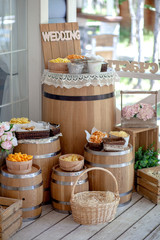  Snacks and pistachios in decorative dishes for candy bar