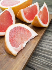 chopped citrus lobules against a tree background