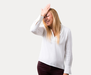 Fototapeta premium Middle age blonde woman with white shirt has just realized something and has intending the solution on isolated grey background